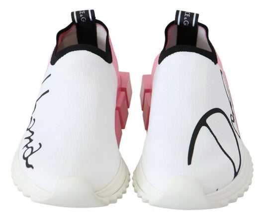 Pair of white and pink sneakers with black laces