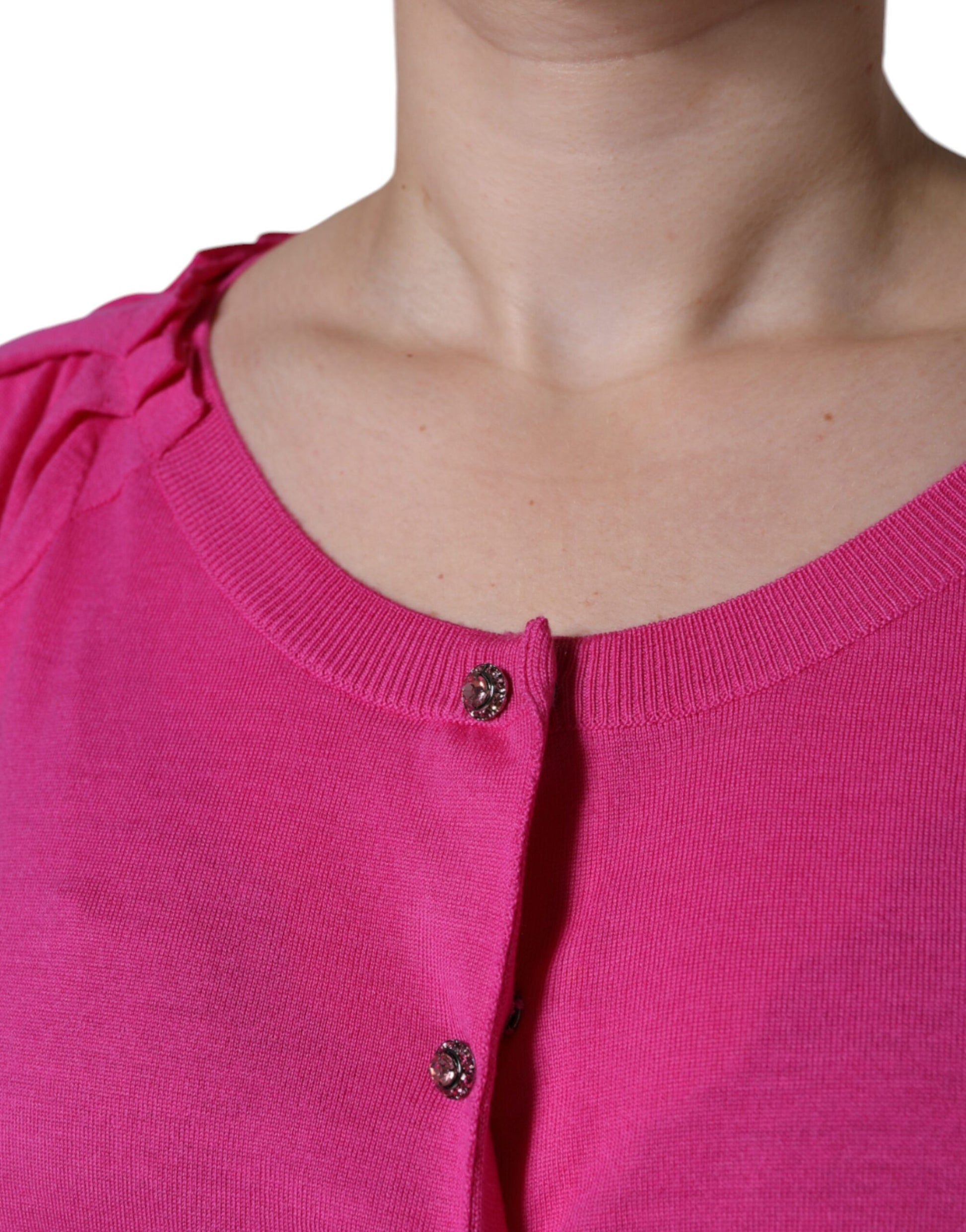 Woman wearing pink sweater with buttons
