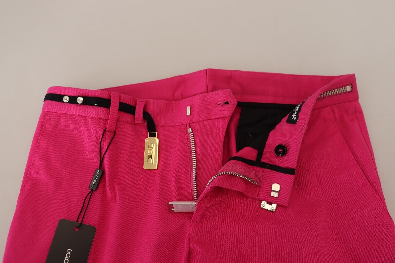 Pair of pink trousers with zippered pockets