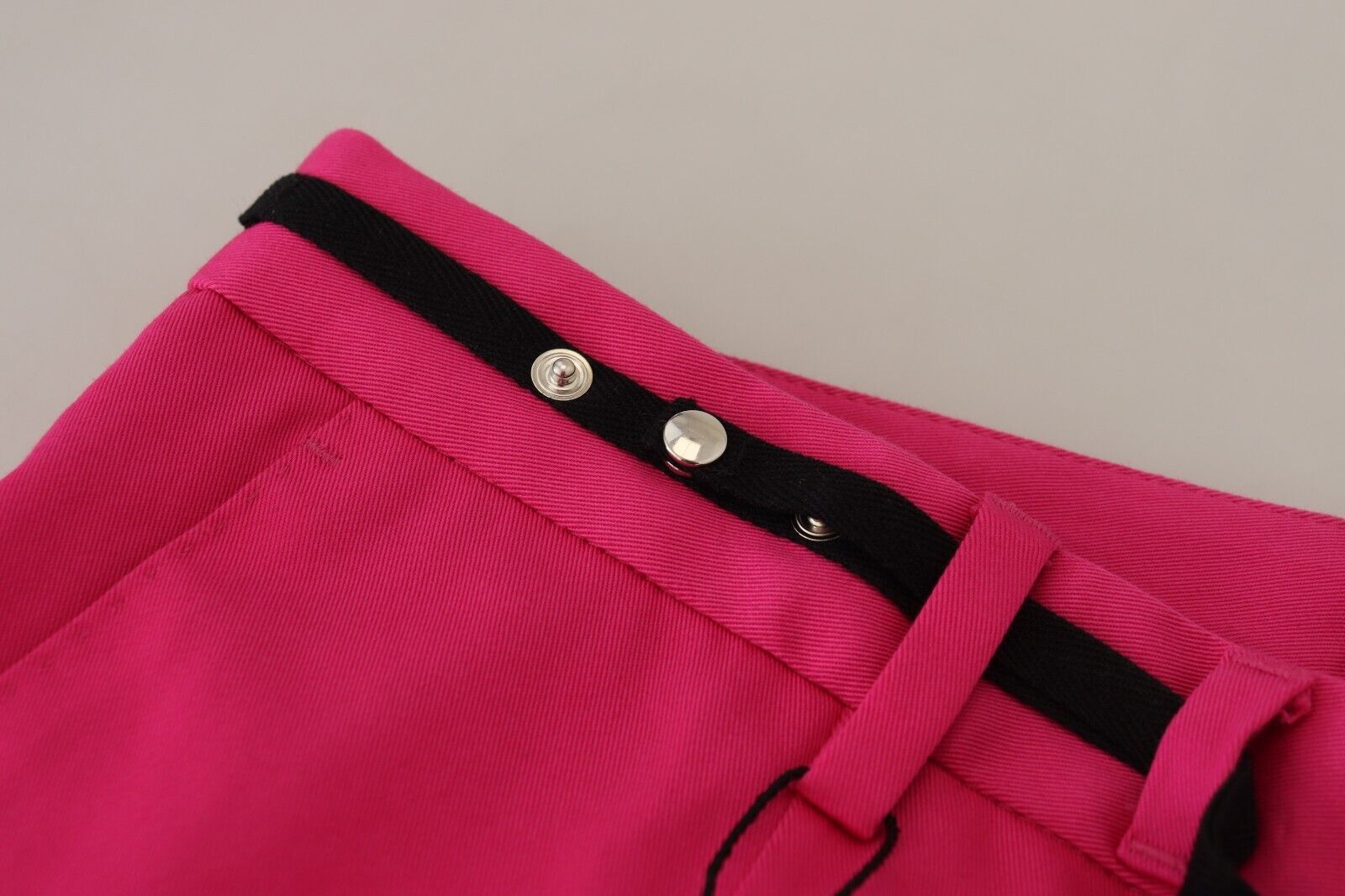 Pair of red pants with black trim and buttons