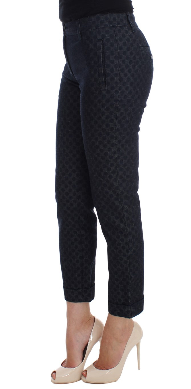 Woman wearing black pants with a pattern and high heels