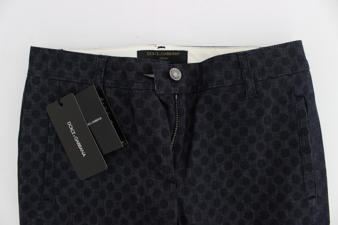 A pair of dark blue shorts with a patterned design on the front. They are laid out flat and appear to be new or unworn. T