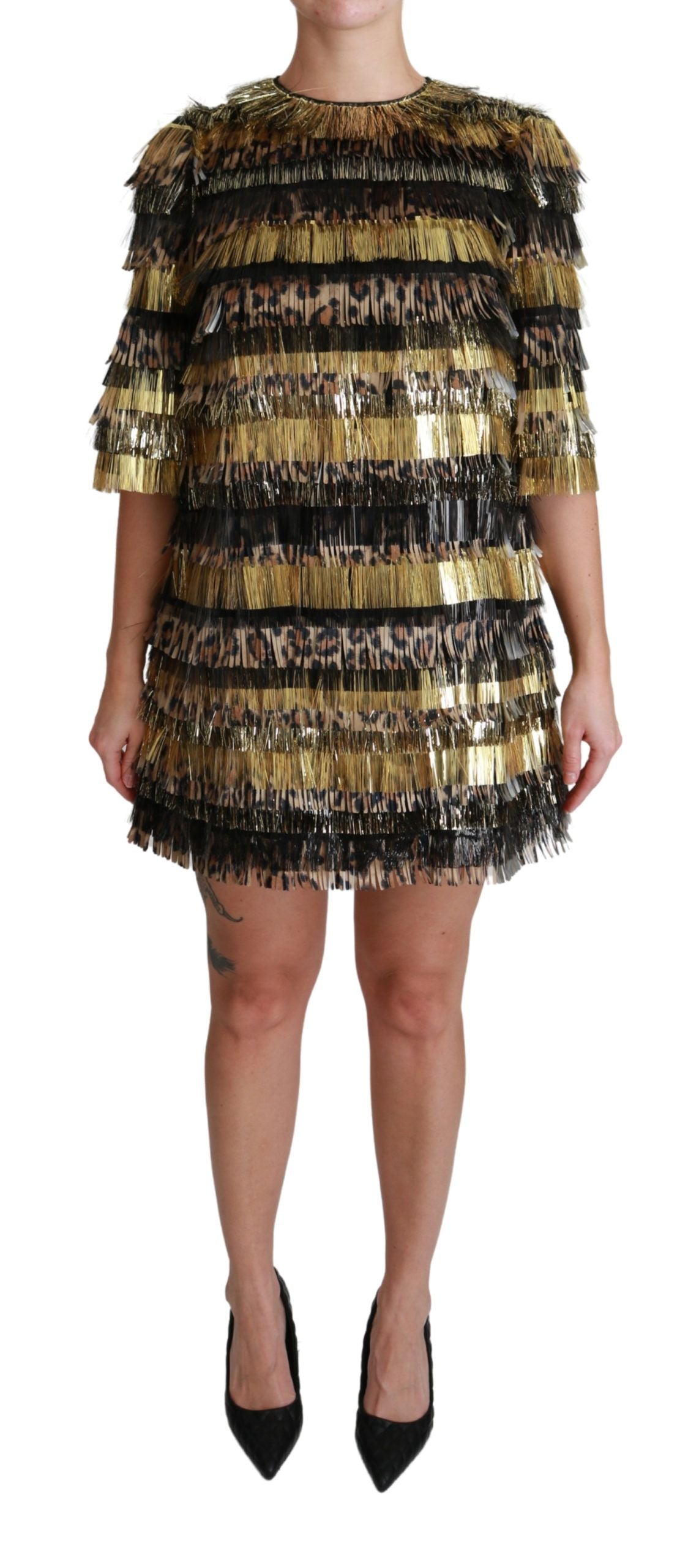 A black and gold leopard print dress with fringe details