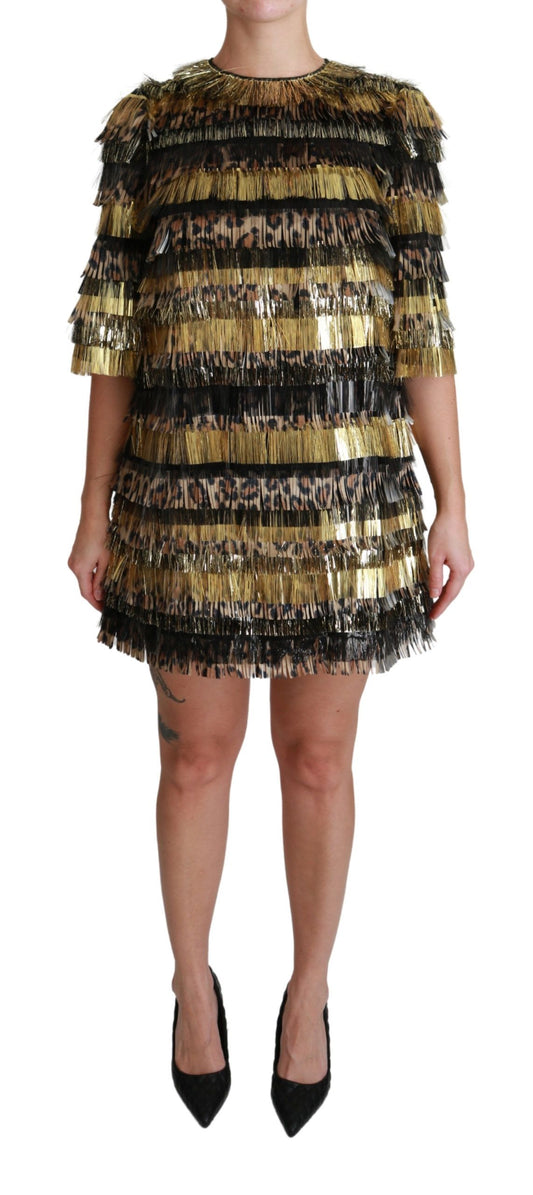 A black and gold leopard print dress with fringe details
