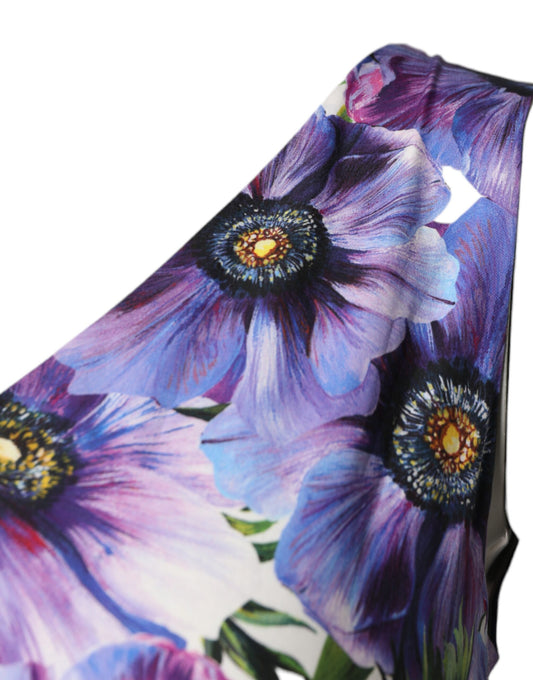 A midi dress with a purple anemone print and pleats