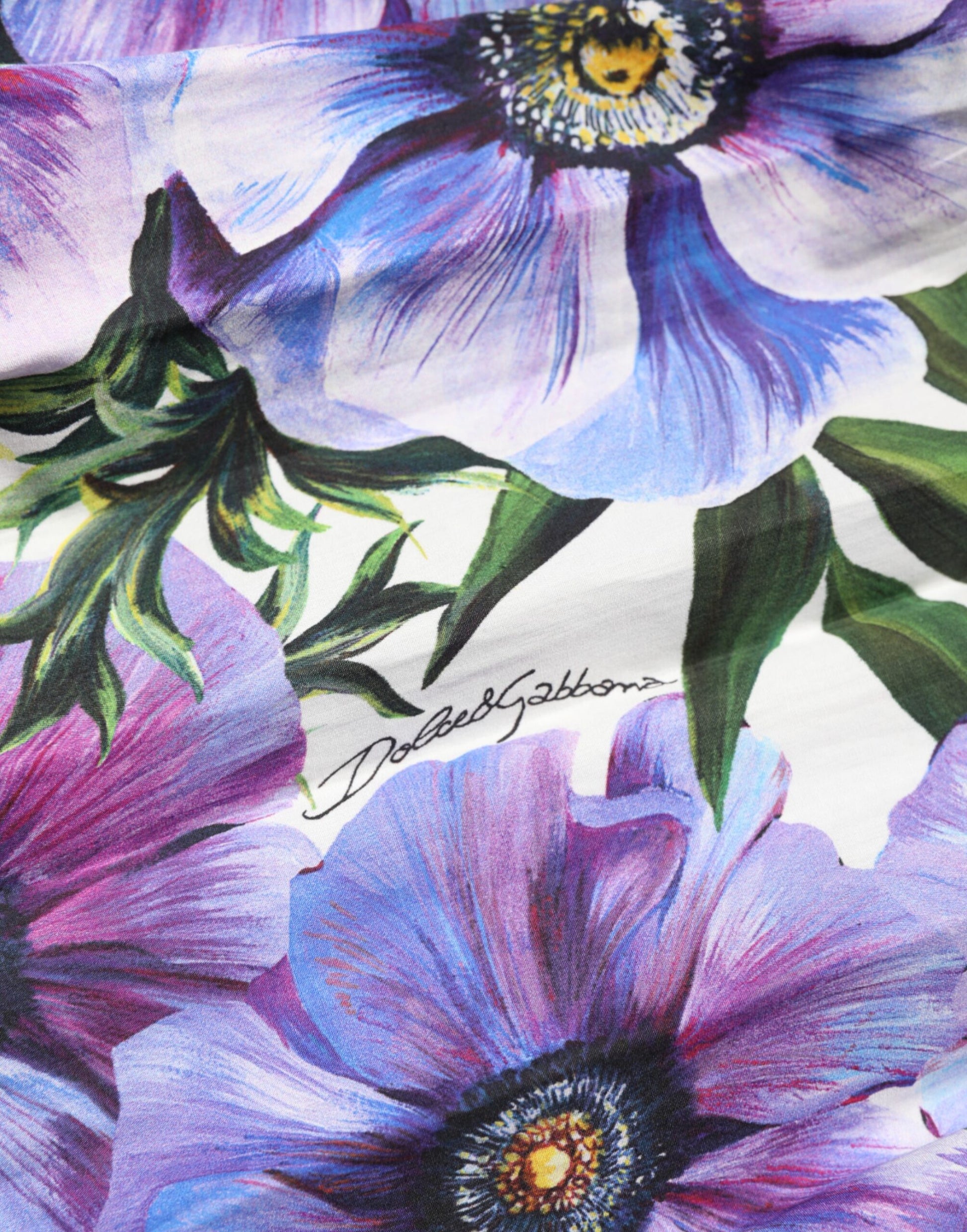 A purple anemone print pleated midi dress by Dolce & Gabbana