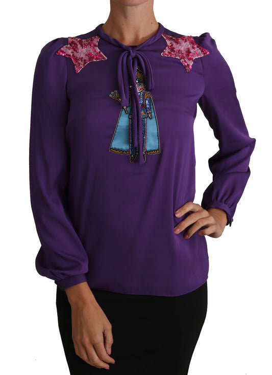 Purple blouse with embroidered design on front