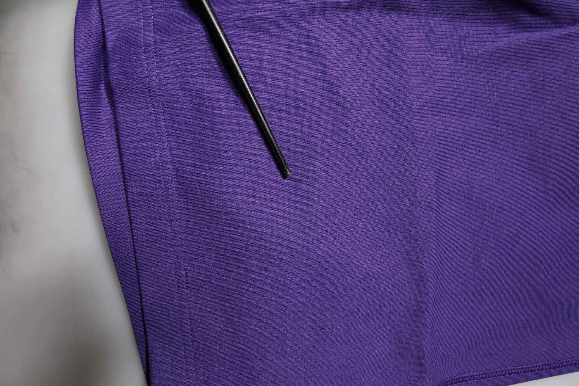 A pair of purple cotton men's bermuda shorts
