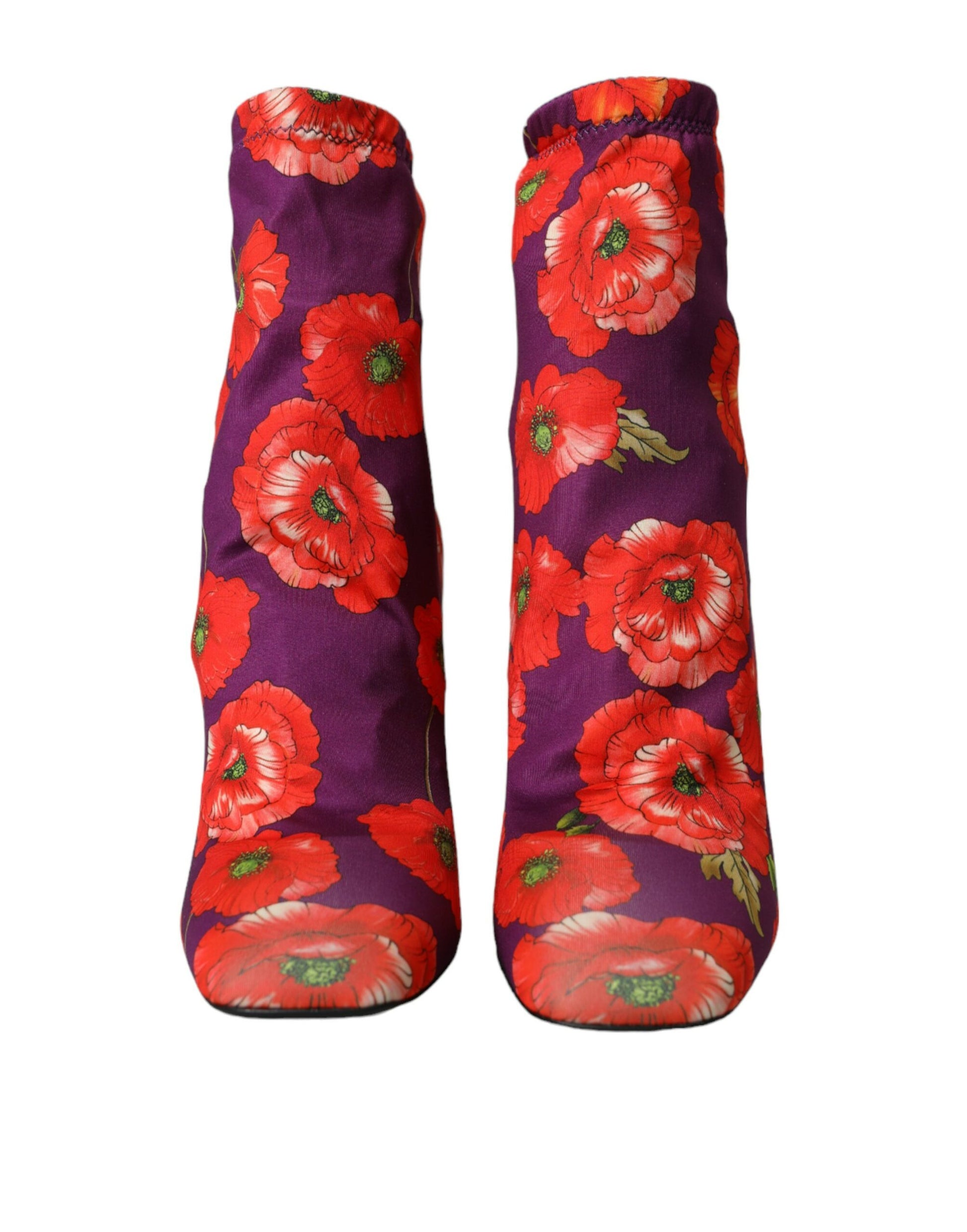 Two red and white floral umbrellas with wooden handles