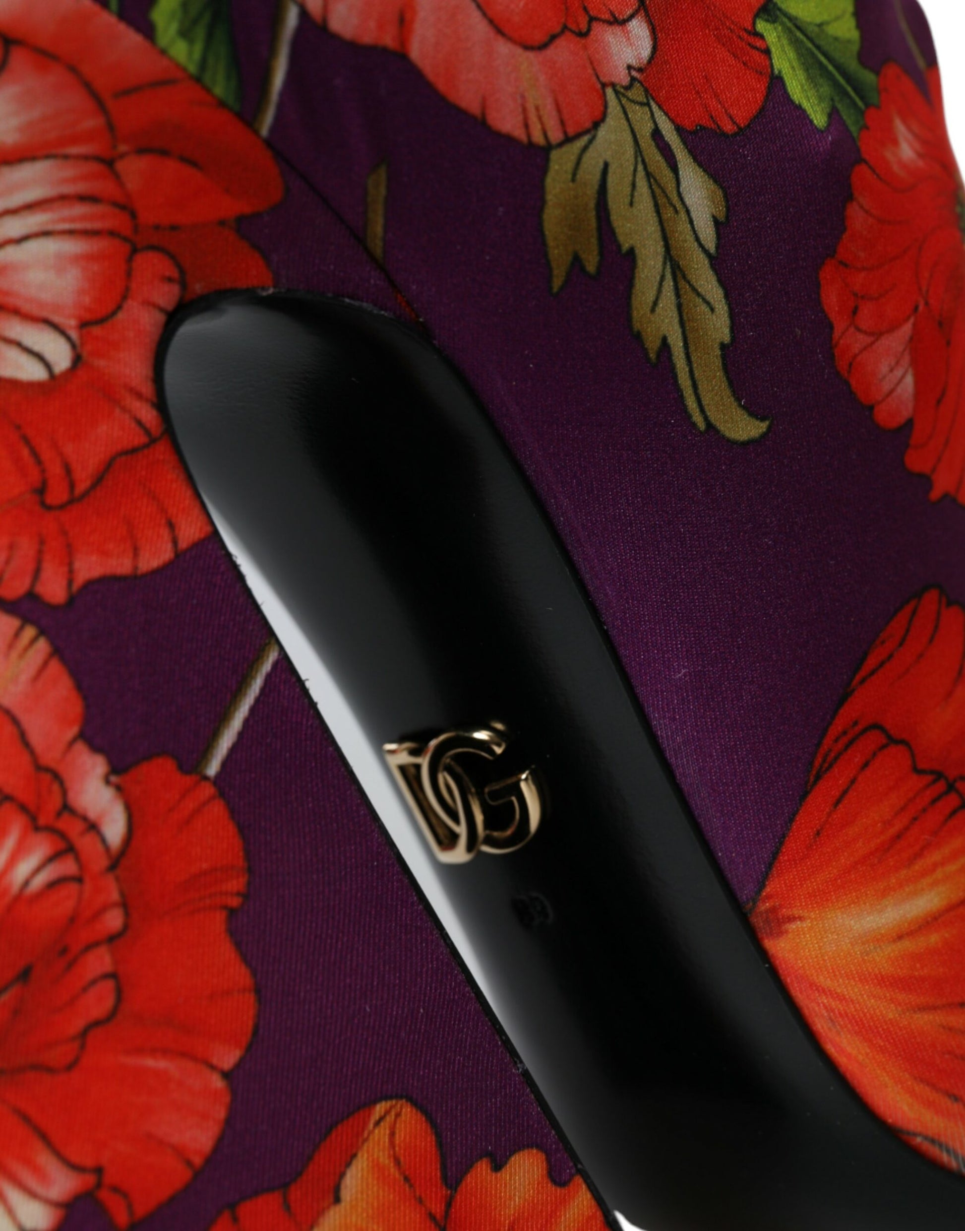 Black hair straightener with gold logo on handle