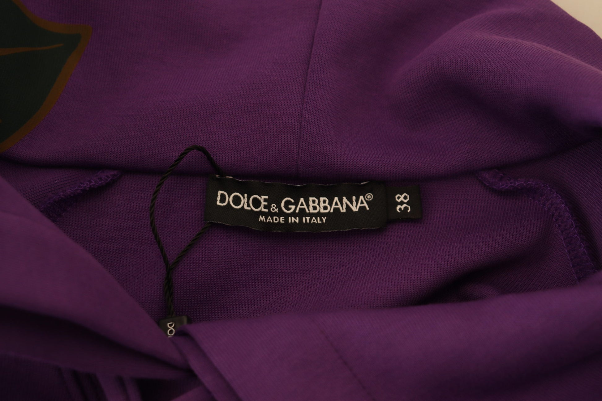 Purple sweater with black label