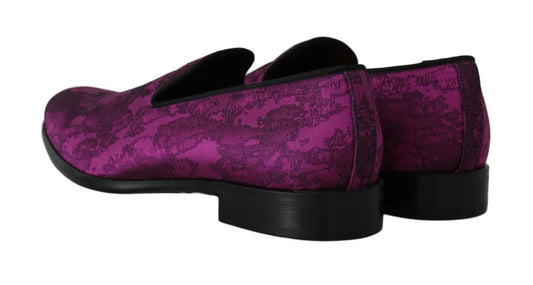 Pair of purple velvet shoes with black soles and heels