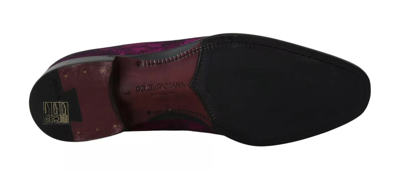 A single shoe against a neutral background. The shoe appears to be a high-top sneaker with a dark upper and a contrasting