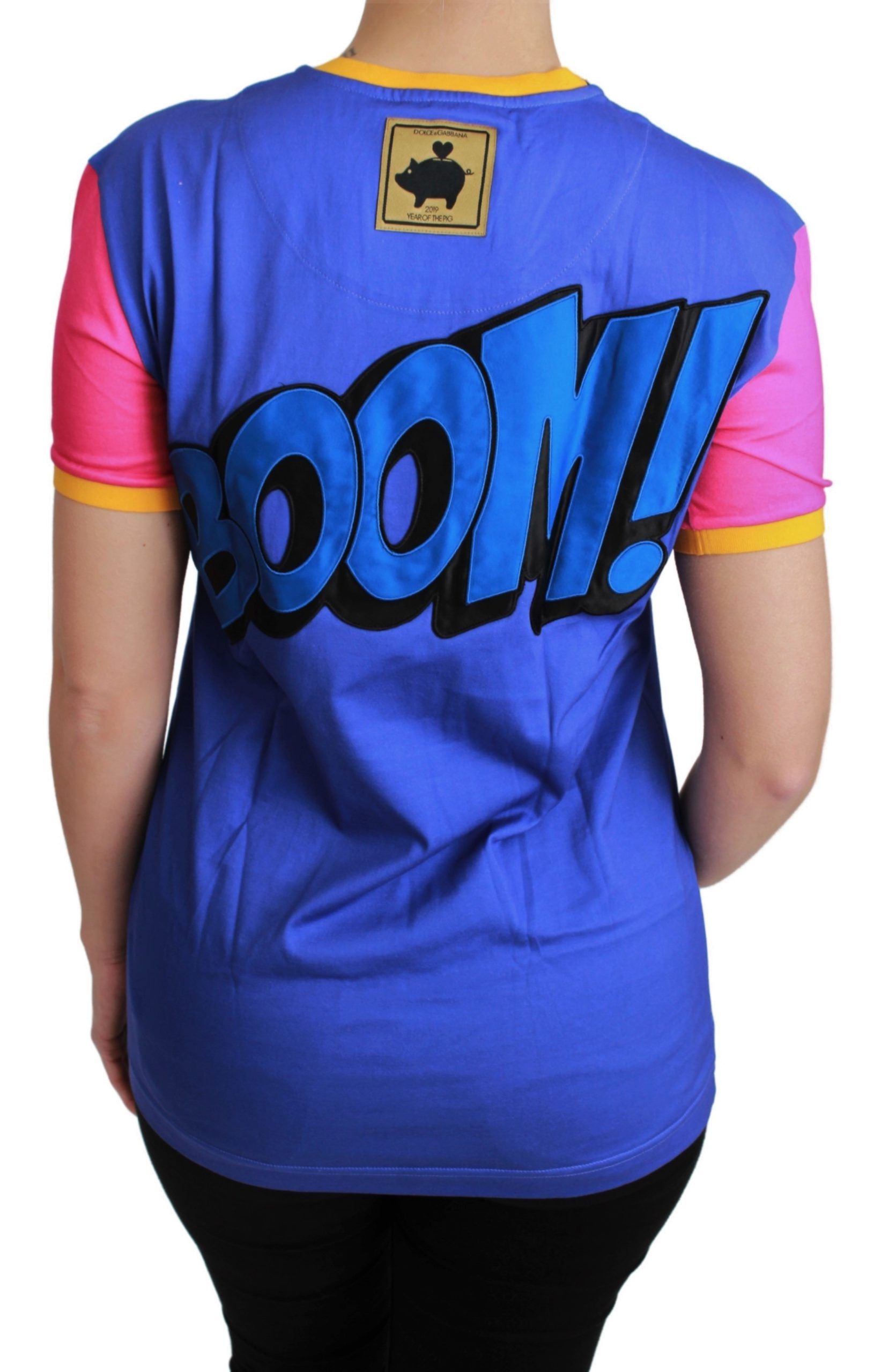A purple t-shirt with a graphic of the word "BOOM!" in bold yellow letters