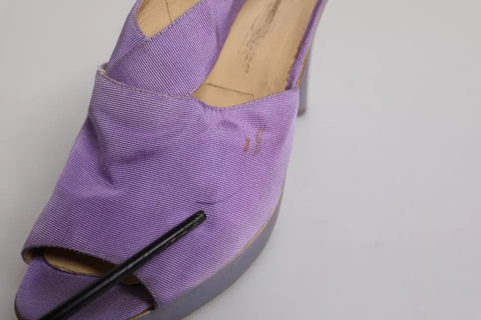 Pair of purple shoes with black heels