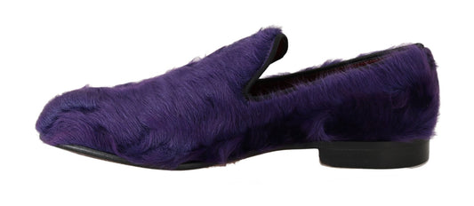 Pair of purple velvet slippers with black soles