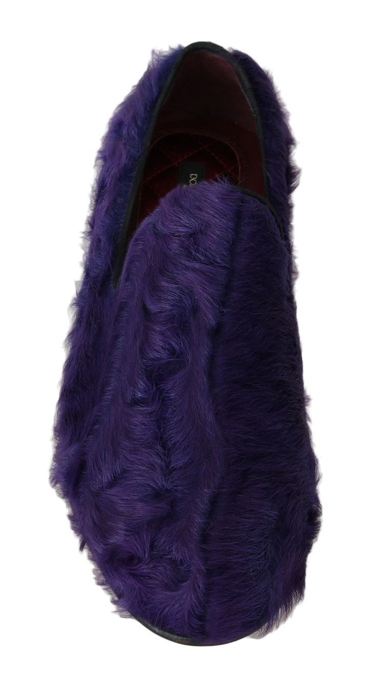 Purple velvet slipper with a furry texture and a red interior