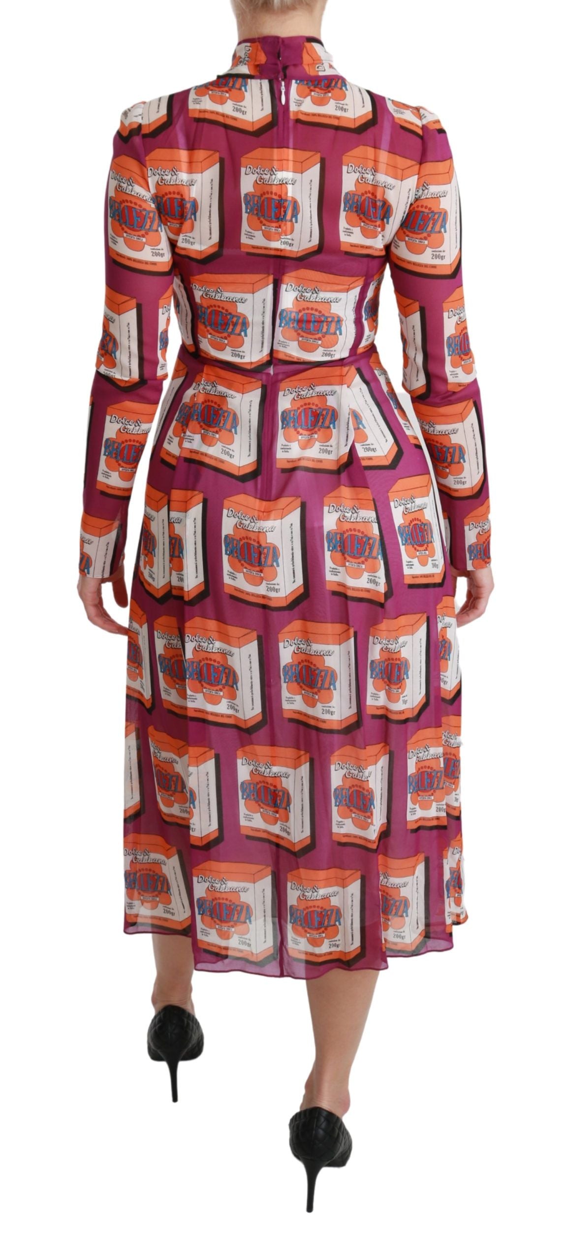 Pink and white patterned dress with long sleeves, high neckline, and fitted waist