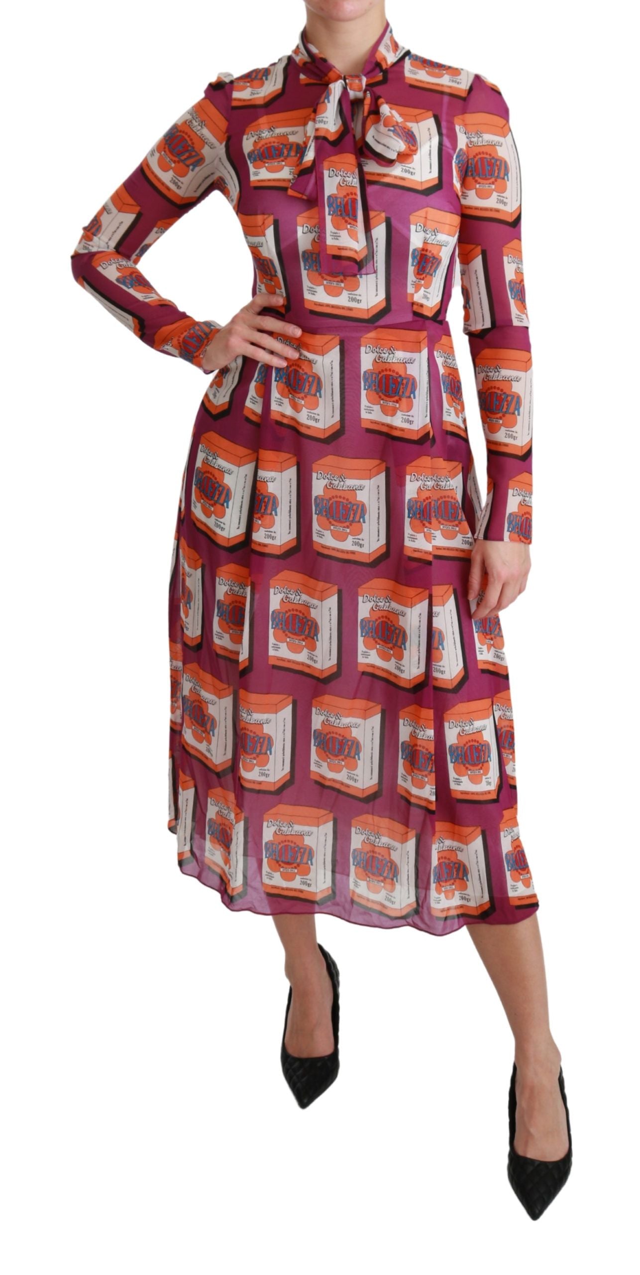 A woman wearing a purple silk dress with a floral pattern. The dress has long sleeves and is designed to be a