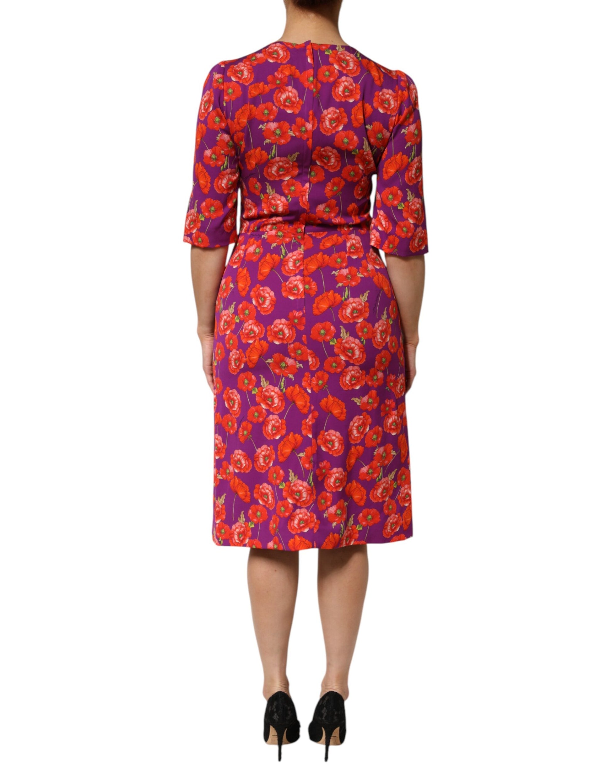 A midi dress with a floral print in shades of purple and red