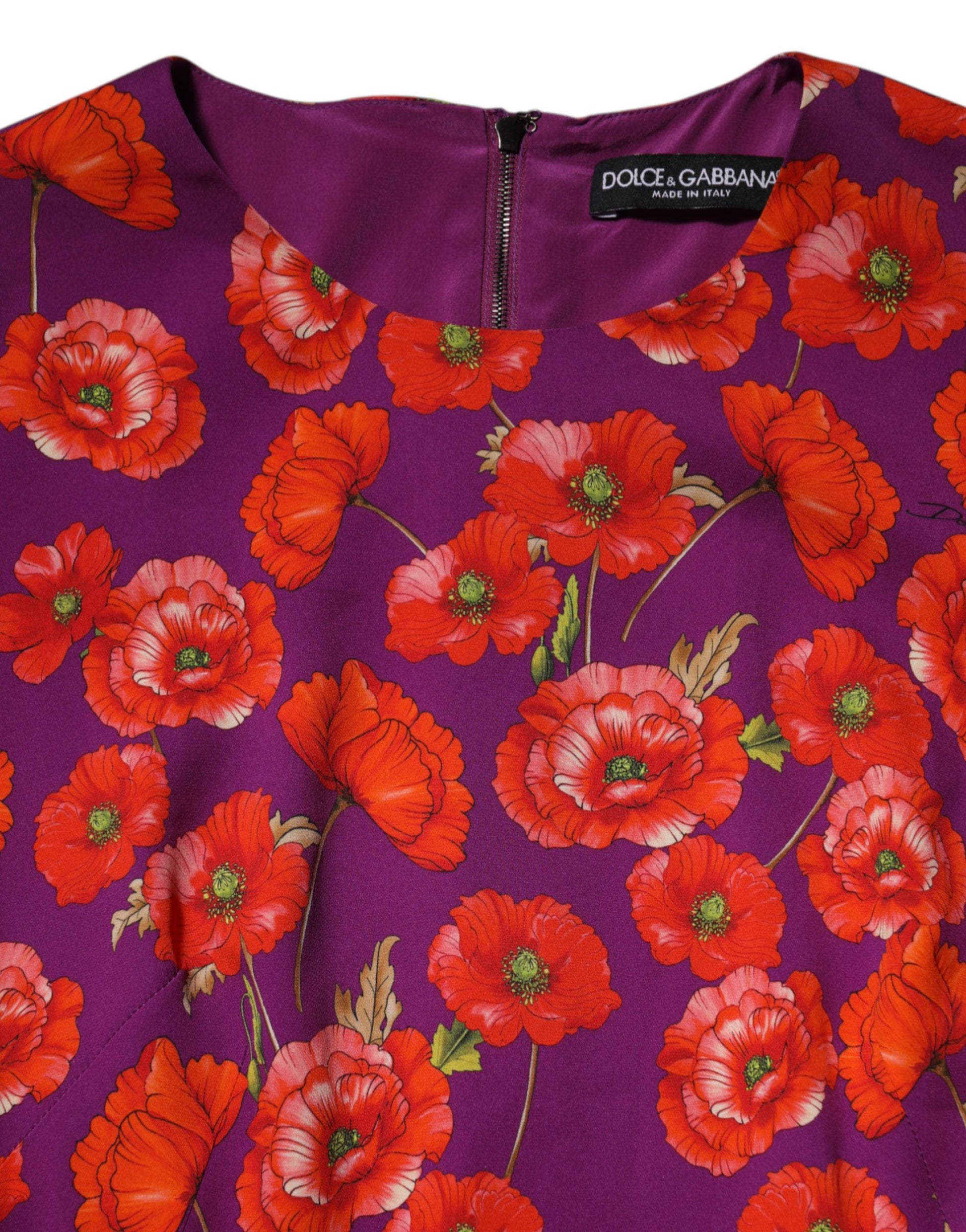 A purple silk midi dress with a floral print featuring red flowers