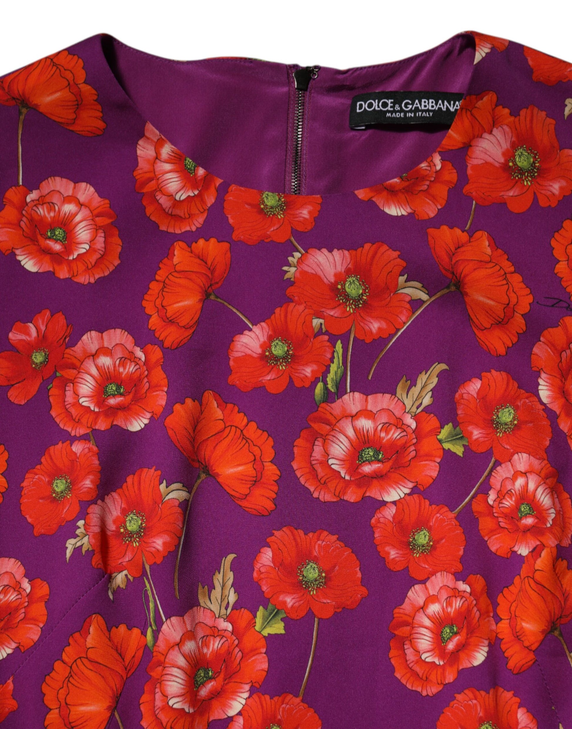 A purple silk midi dress with a floral print featuring red flowers