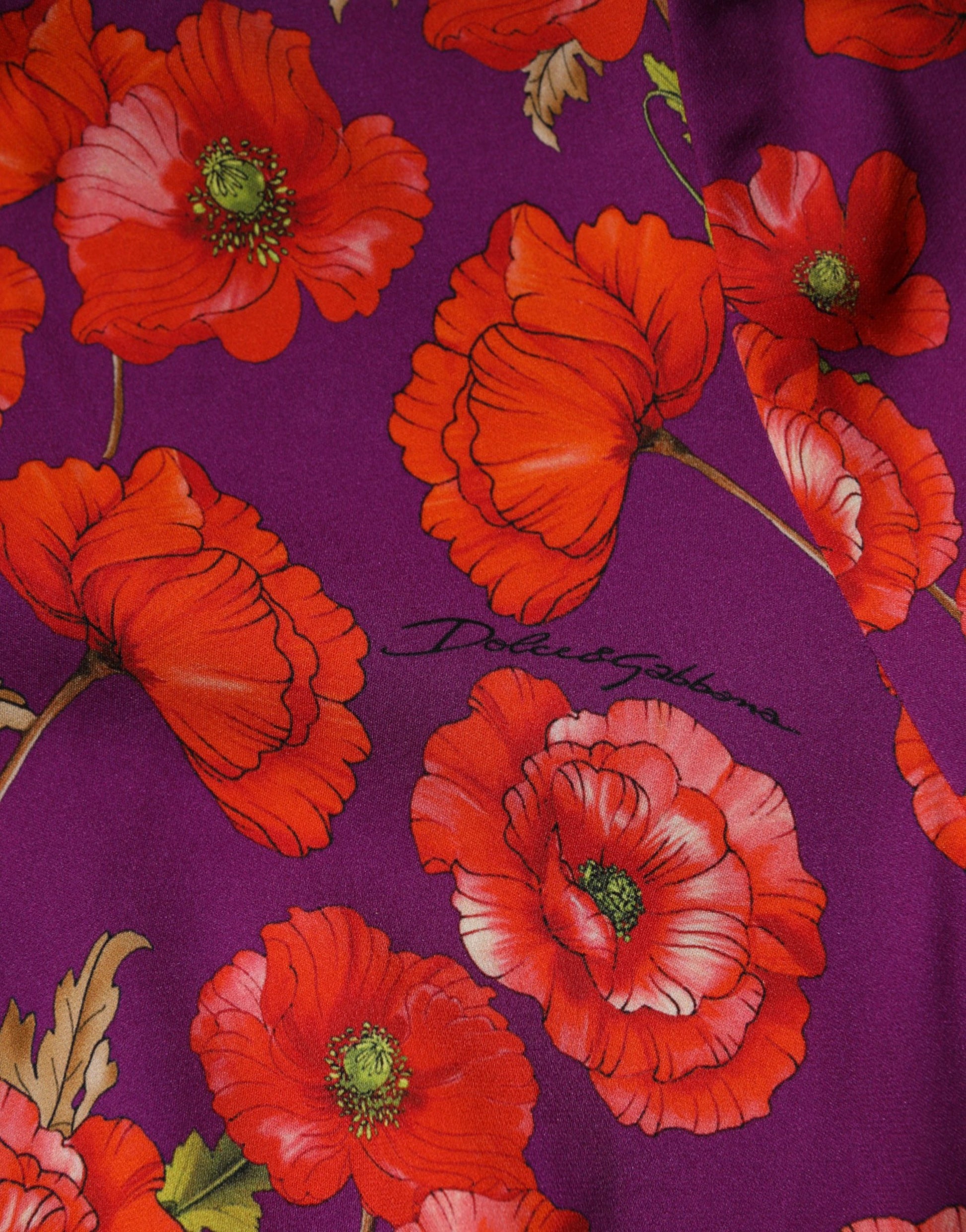 A purple silk midi sheath dress with a floral print featuring red flowers