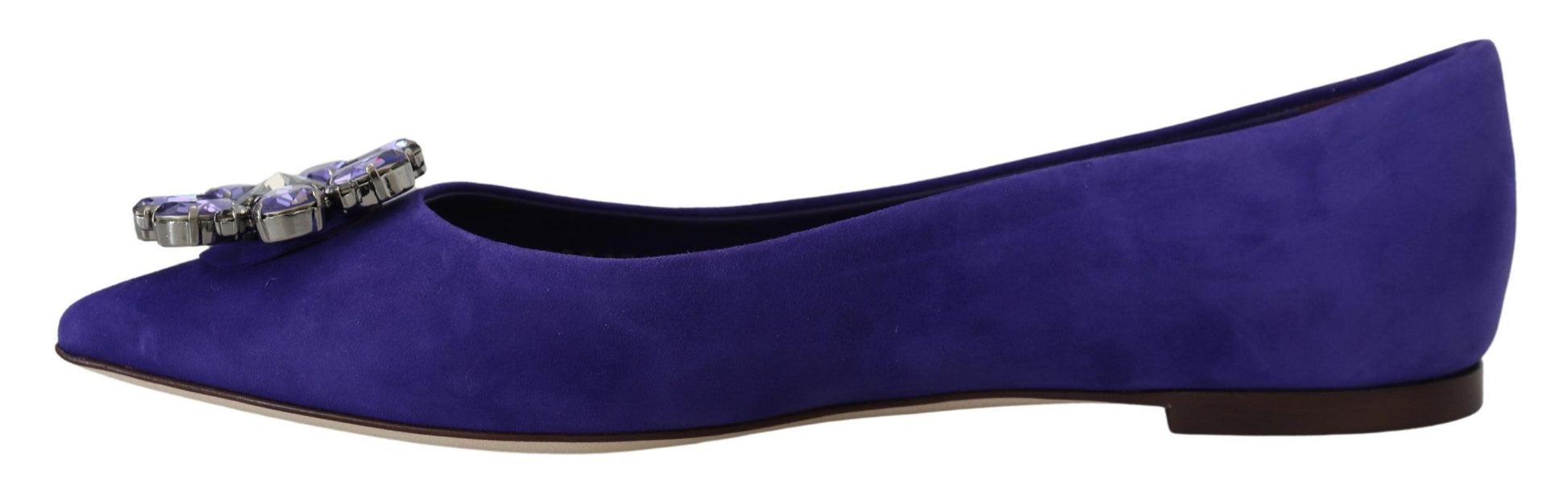 Pair of purple velvet shoes with a bow on top