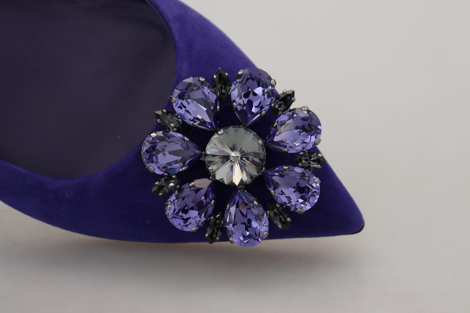 Purple velvet shoe with large sparkling jewel embellishment