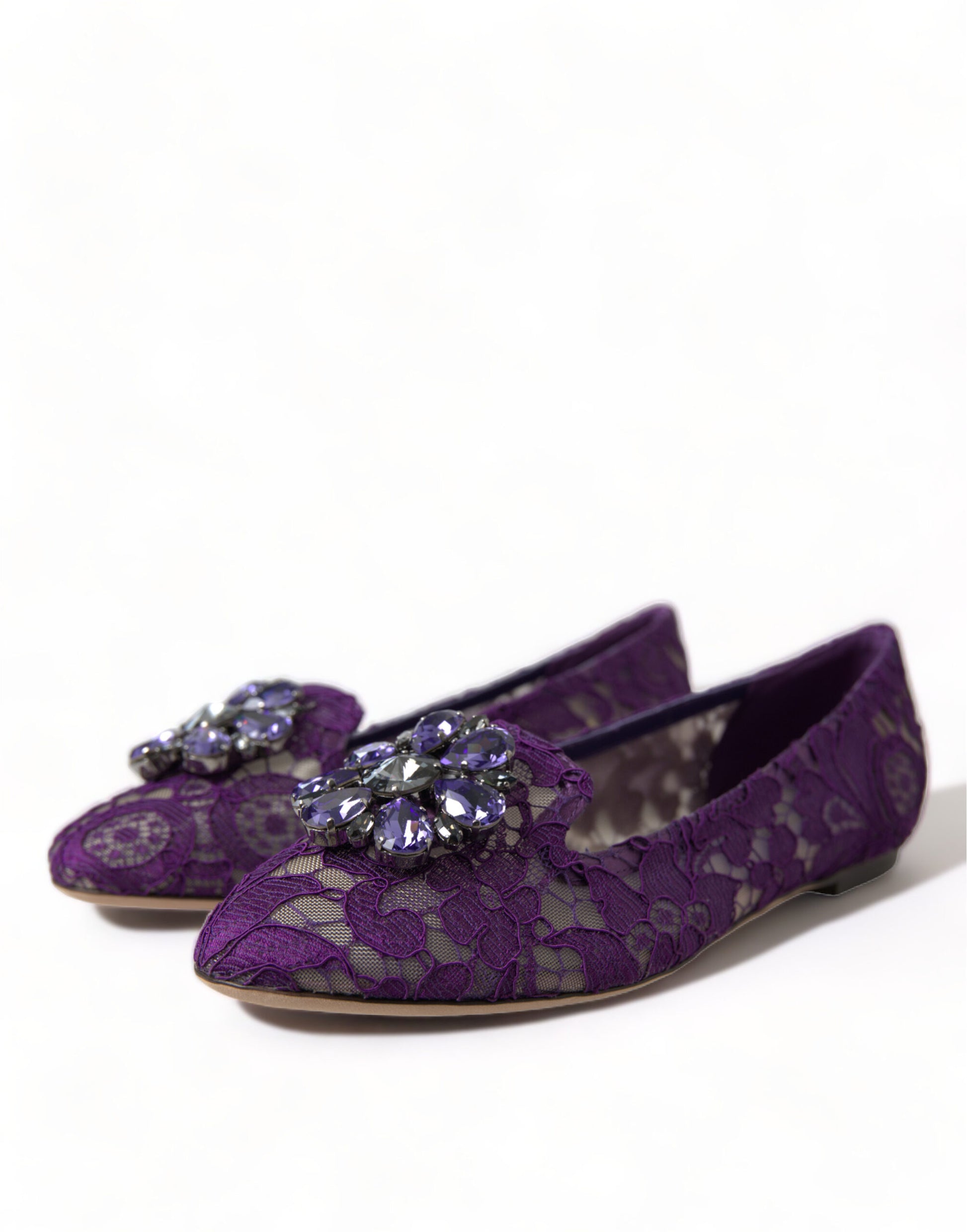 Pair of purple lace shoes with embellished heels and toes