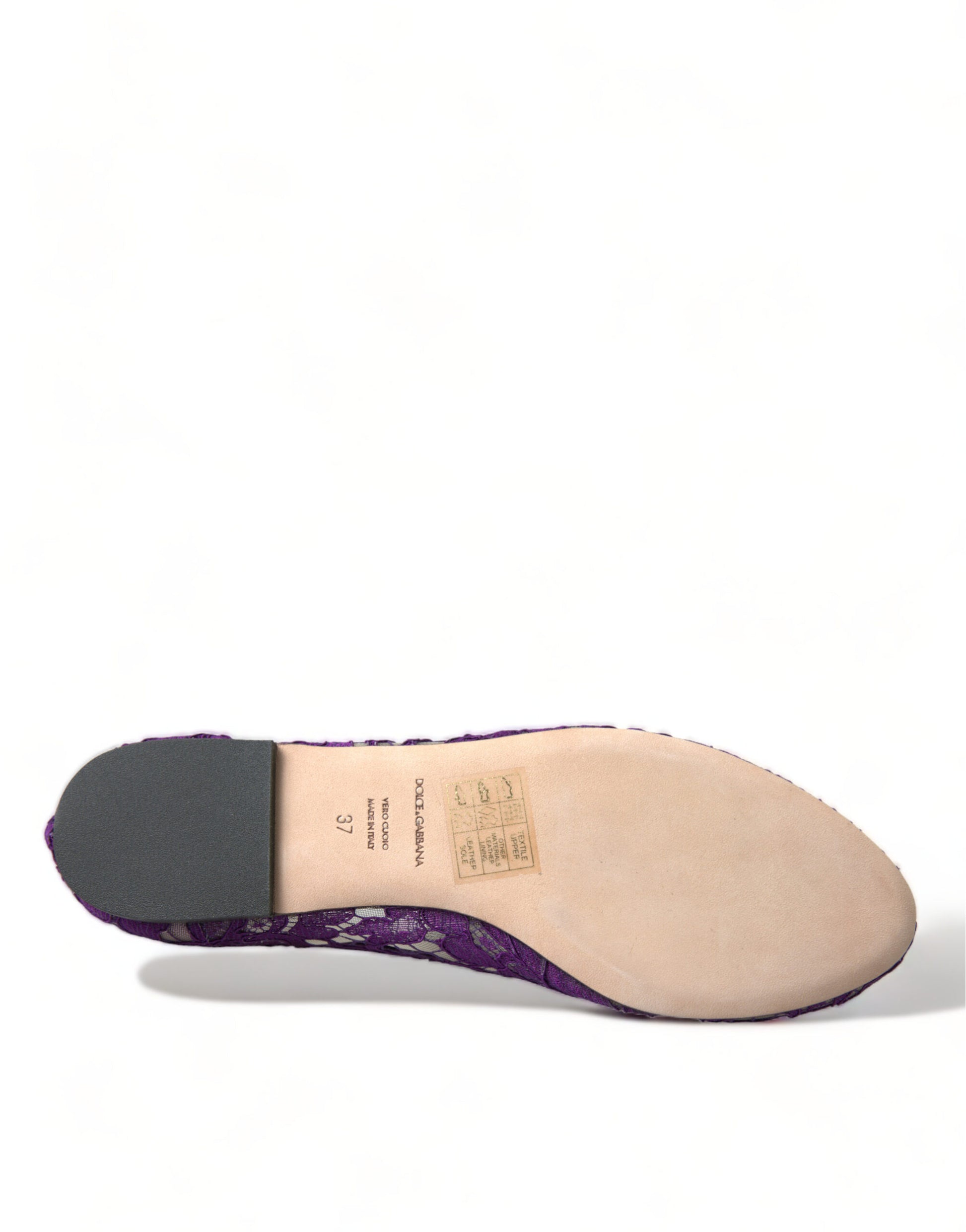 A single shoe against a white background with a pattern of vertical lines. The shoe appears to be a women's flat with a p
