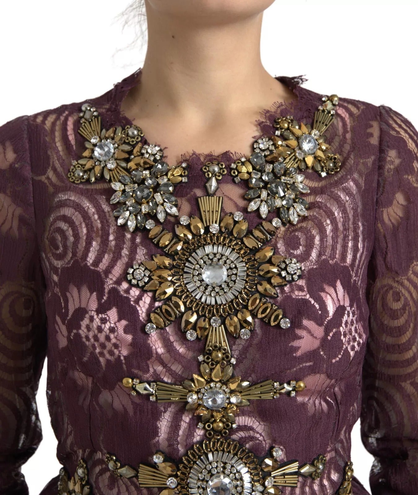 A purple viscose dress with crystal embellishments. It features an A-line silhouette and is designed by Dolce