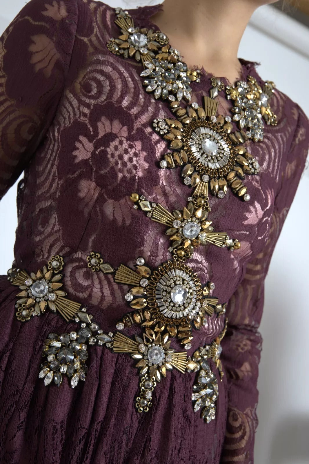 A purple viscose dress with crystal embellishments and an A-line silhouette