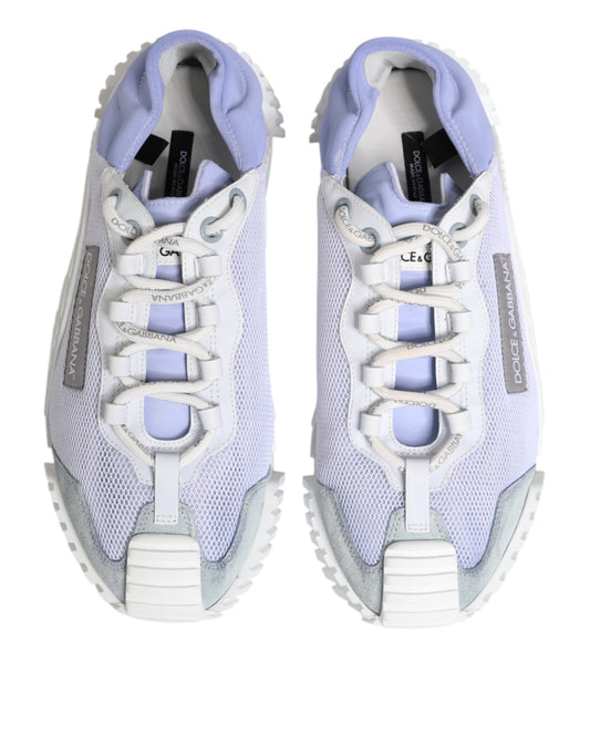 Pair of lace-up sneakers in purple and white with a low top