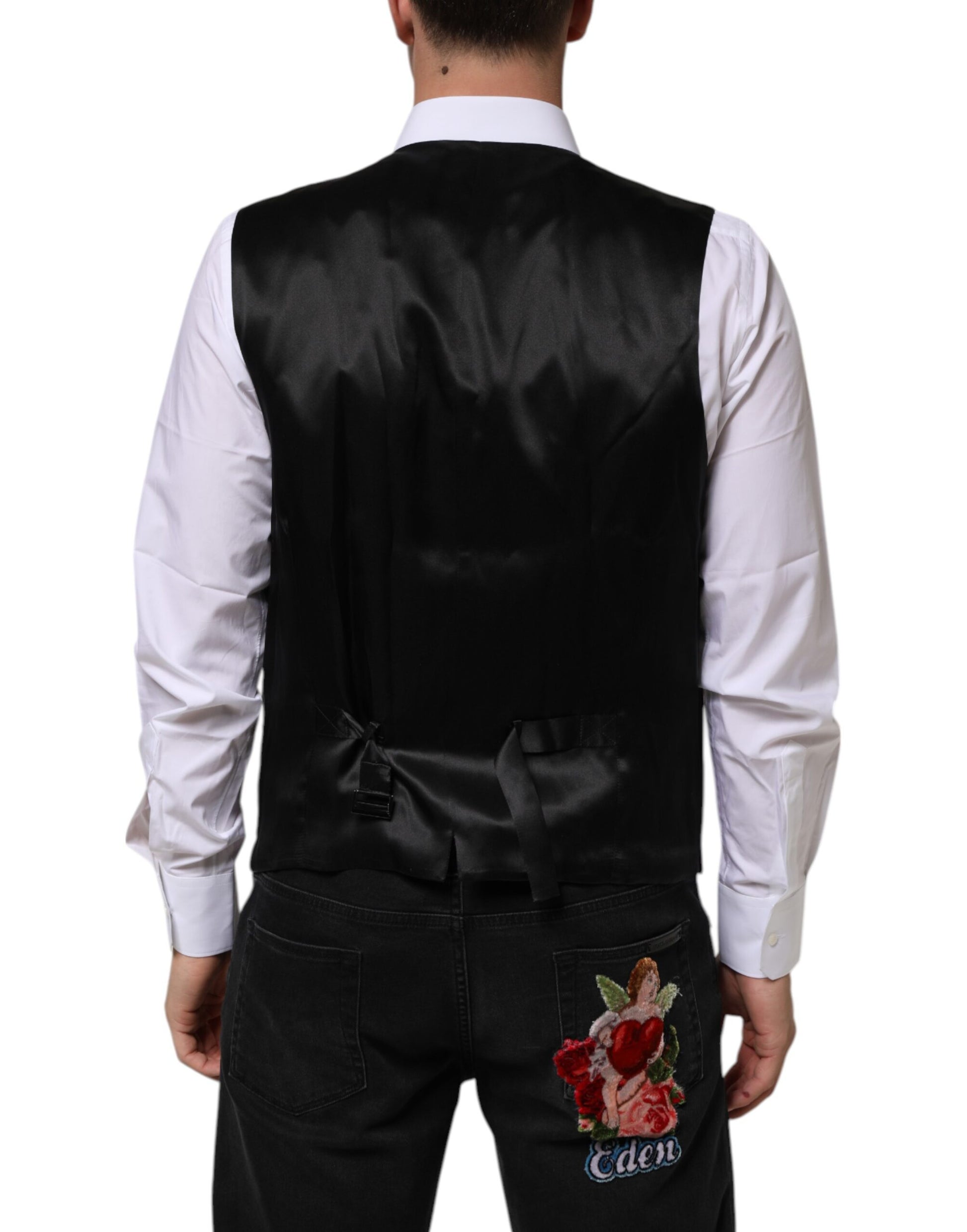 A mannequin wearing a purple wool vest over a black shirt