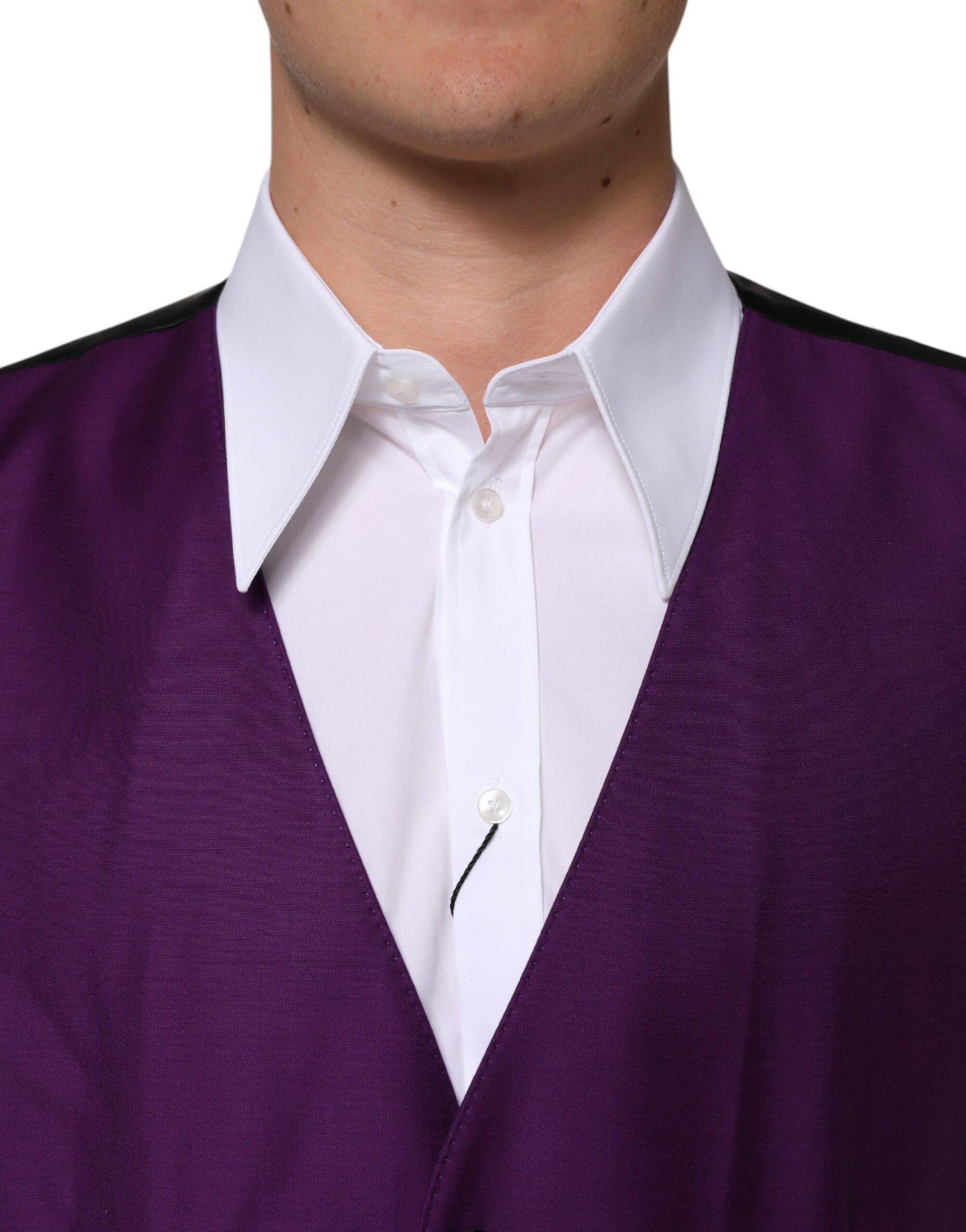 A purple wool vest with a white shirt underneath