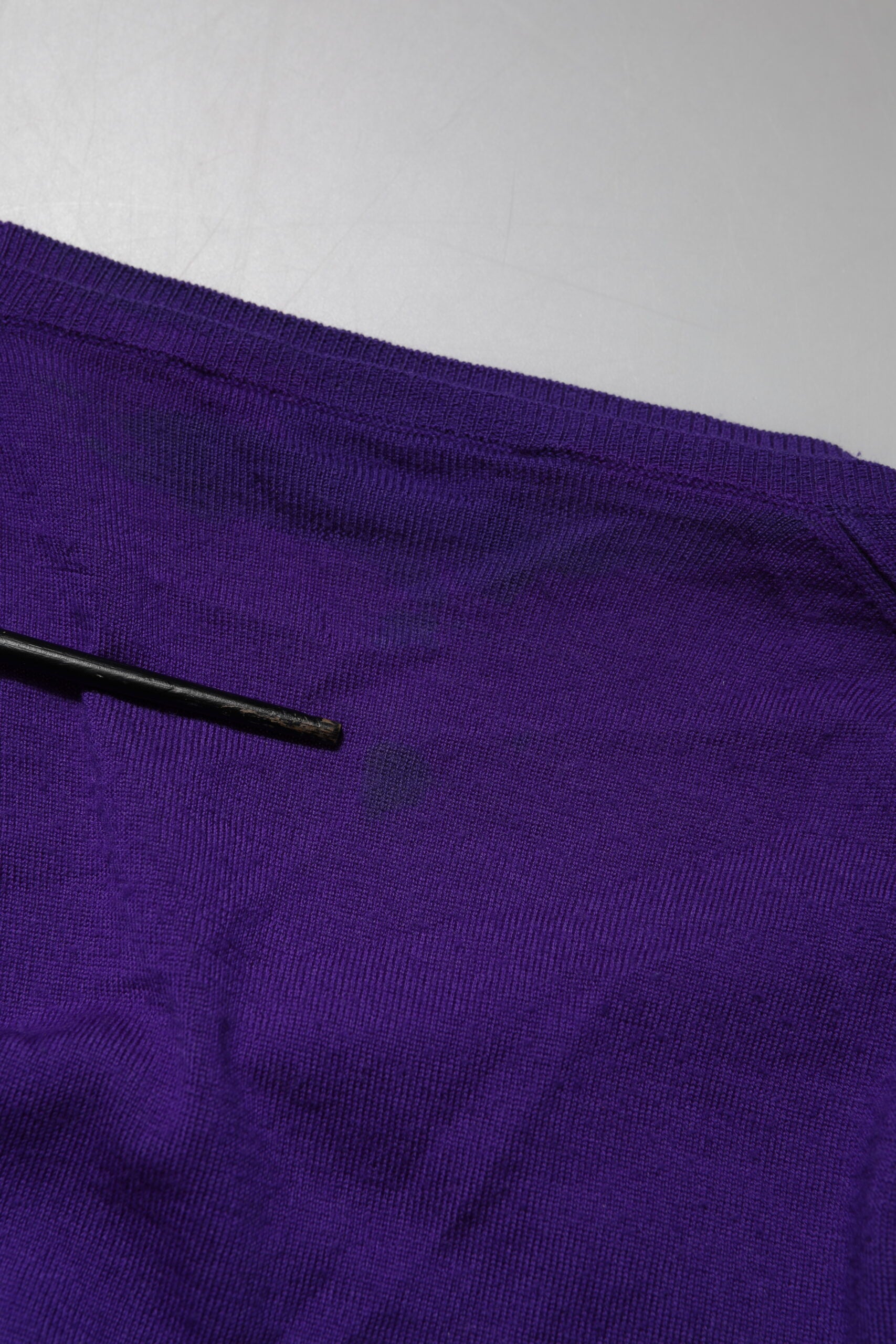Purple fabric with a black zipper