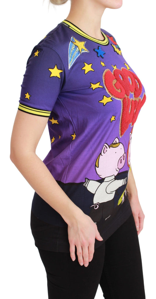 Woman wearing a purple t-shirt with cartoon character on front