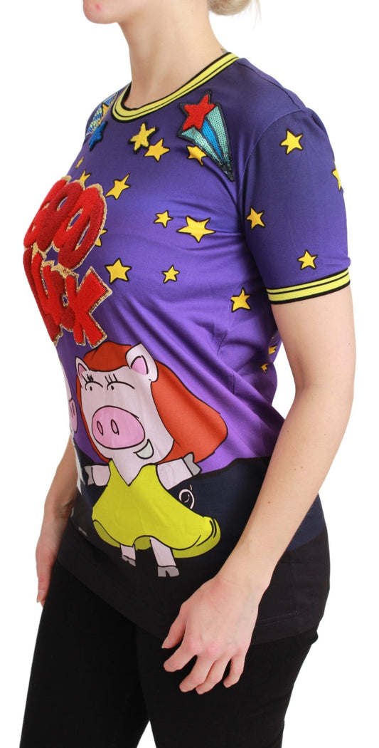 Woman wearing a purple t-shirt with cartoon design