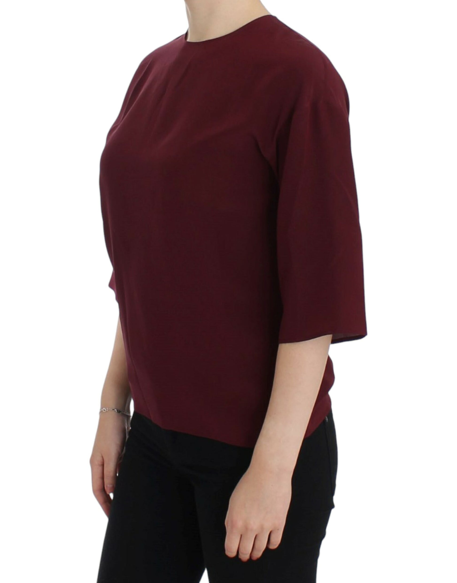 Woman wearing maroon top