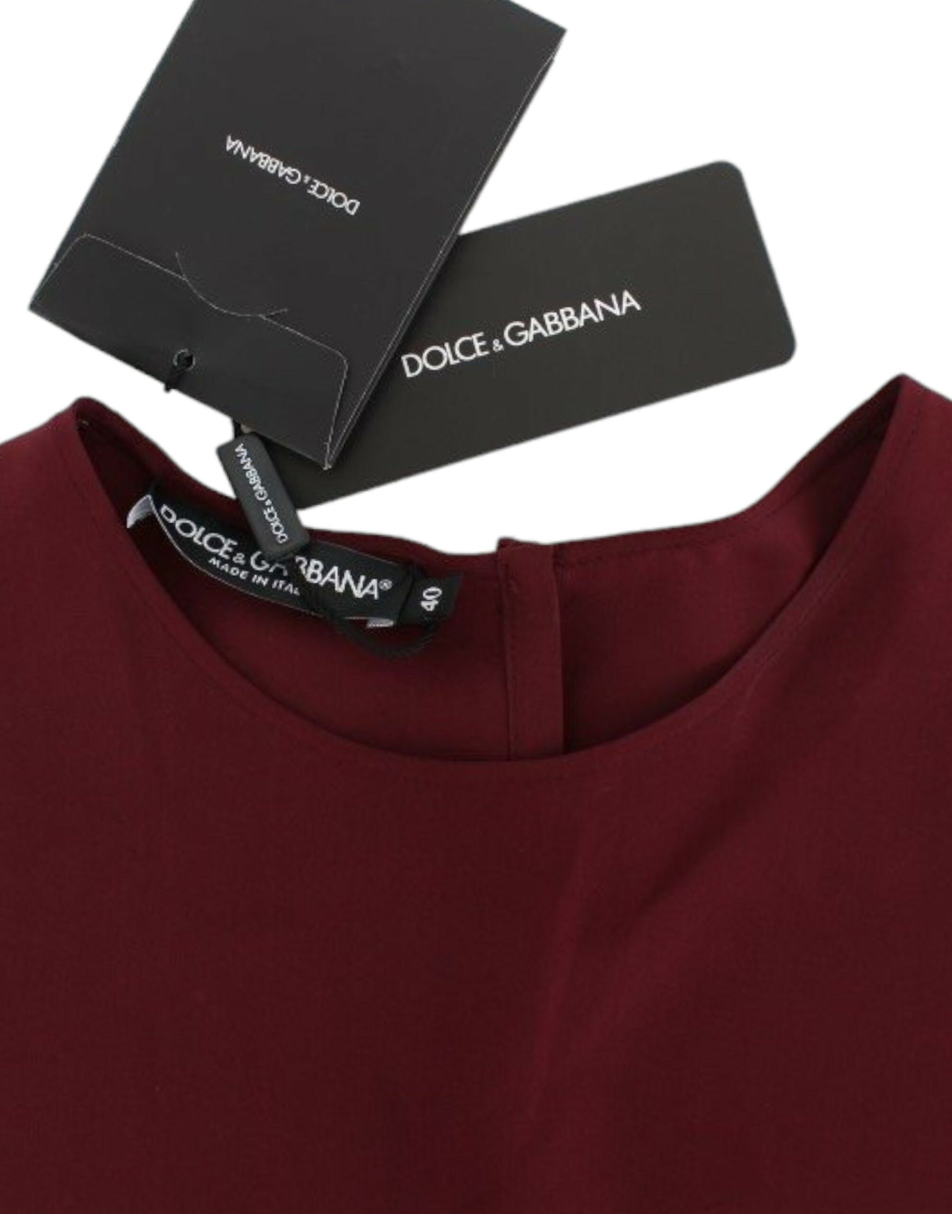 Red shirt on hanger with black tag