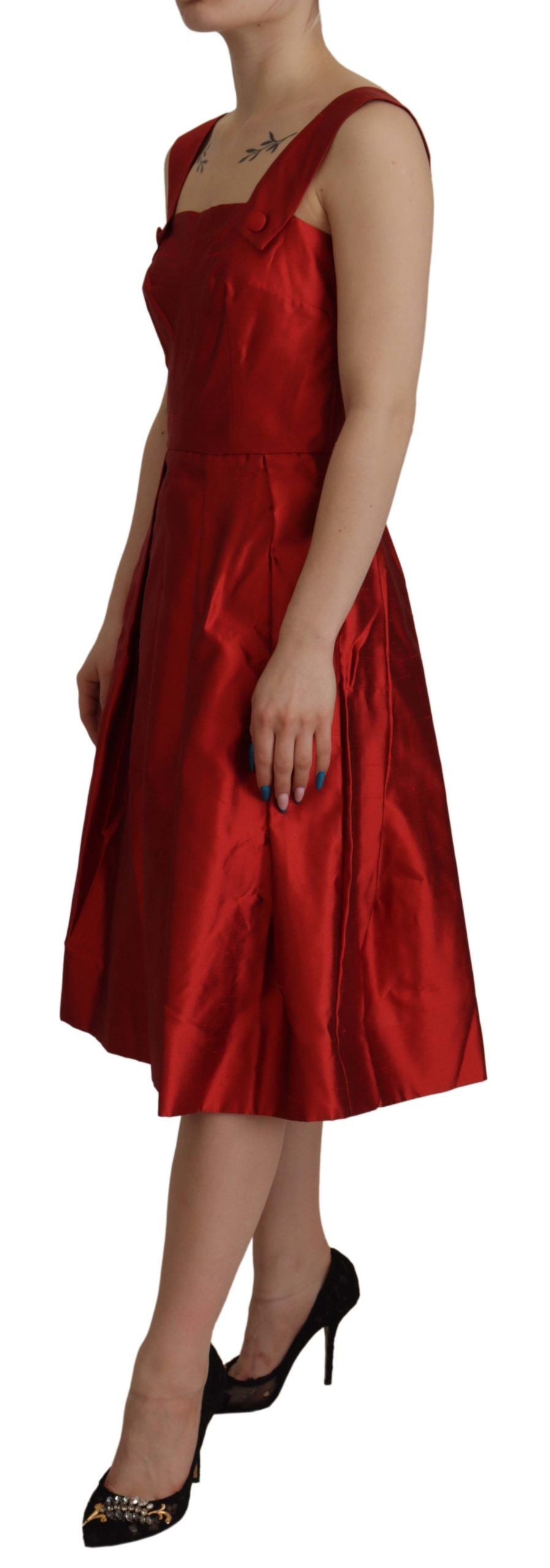 A red satin silk dress with pleats and a fitted waist. It is an A-line style, suggesting it falls straight fr