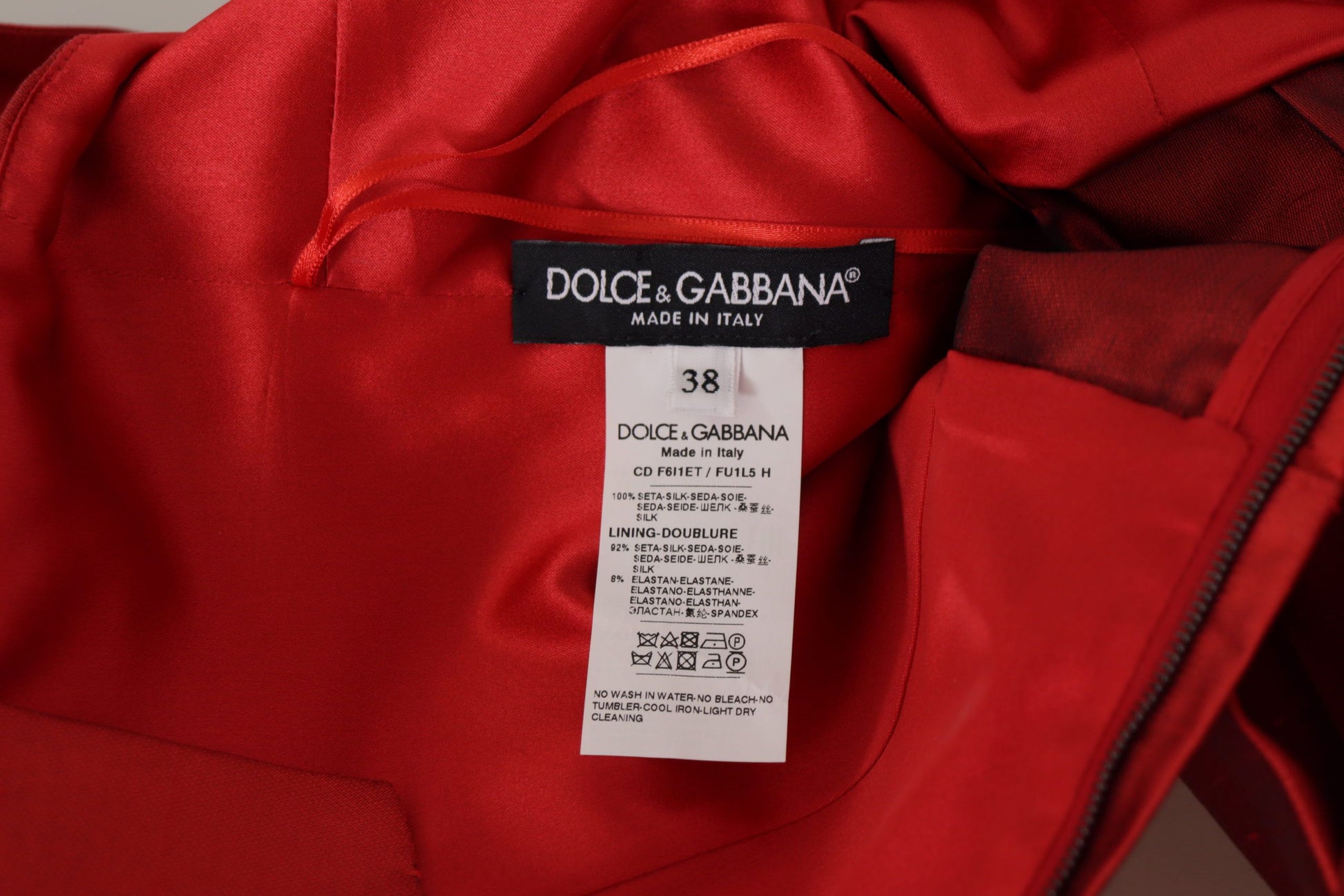 Red satin silk dress with pleats, branded by Dolce & Gabbana