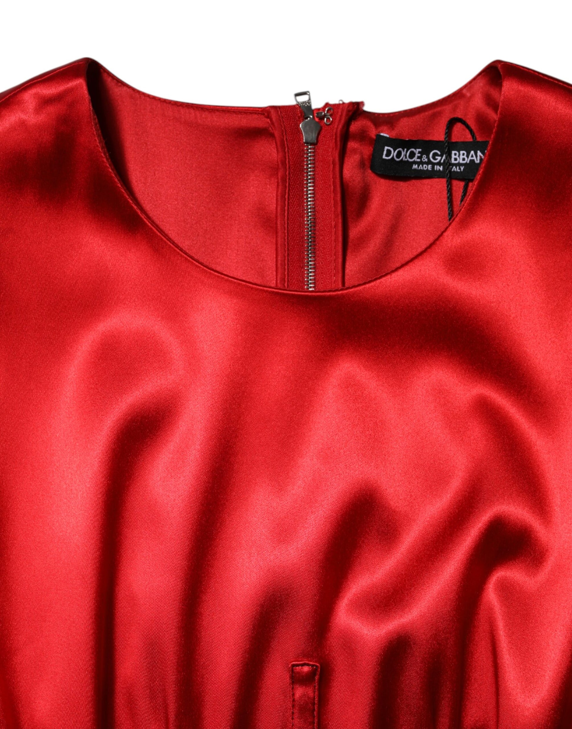 A red sleeveless sheath midi dress with a zippered front