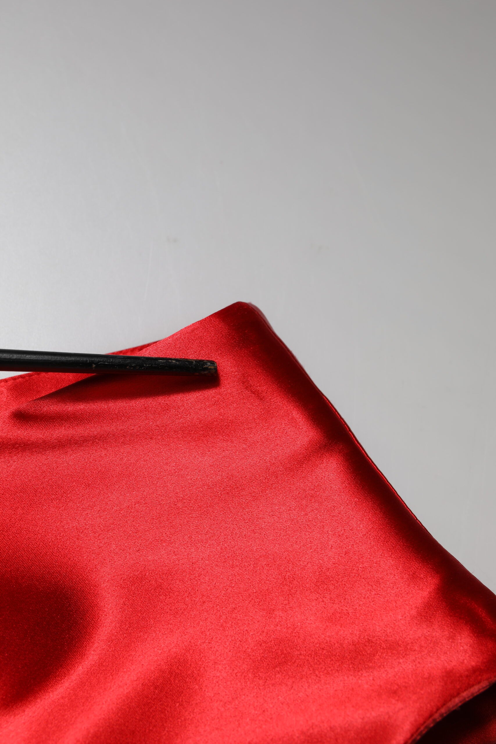 A red sleeveless sheath midi dress with acetate fabric