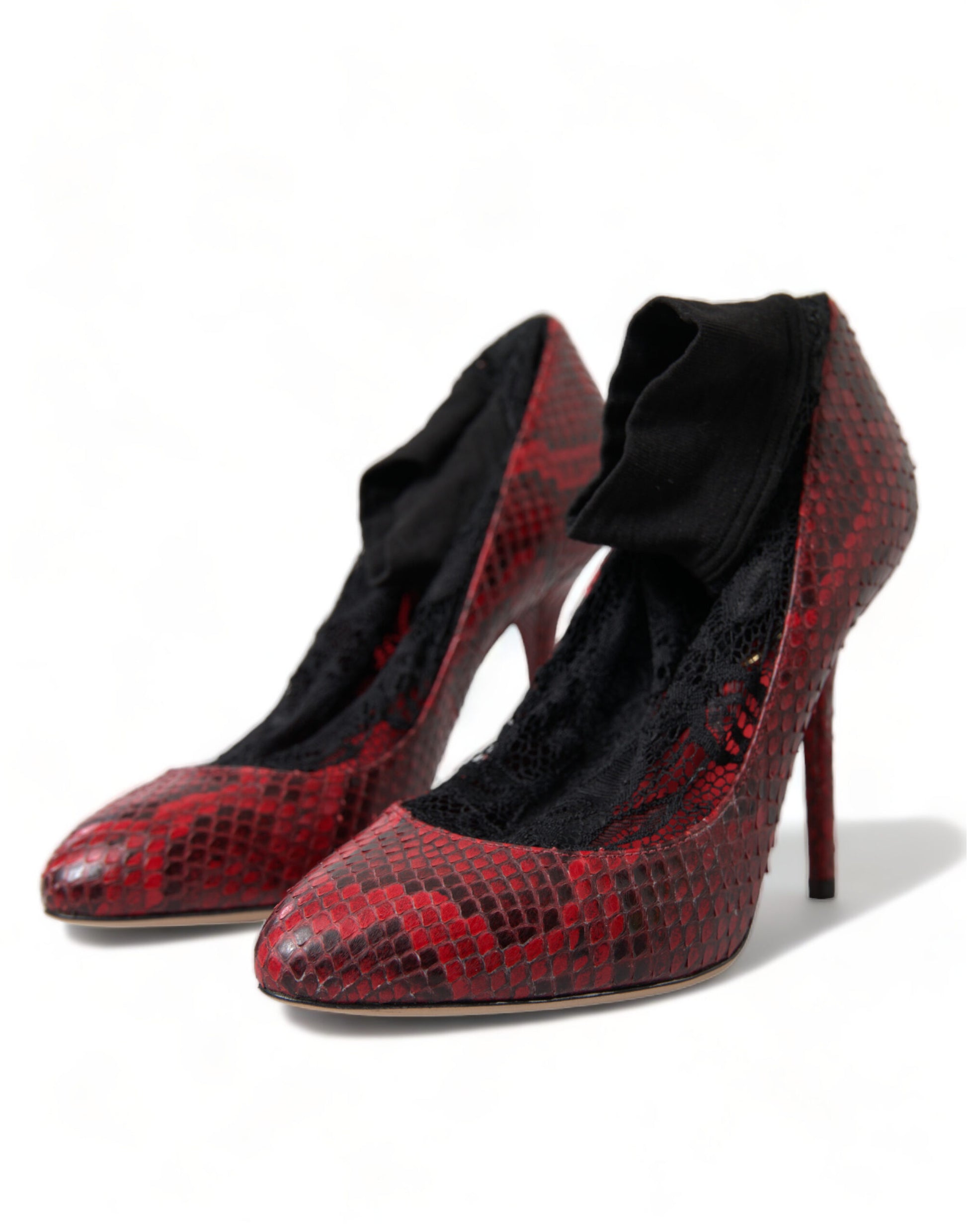 Pair of red high heel shoes with black lace and a snake skin texture