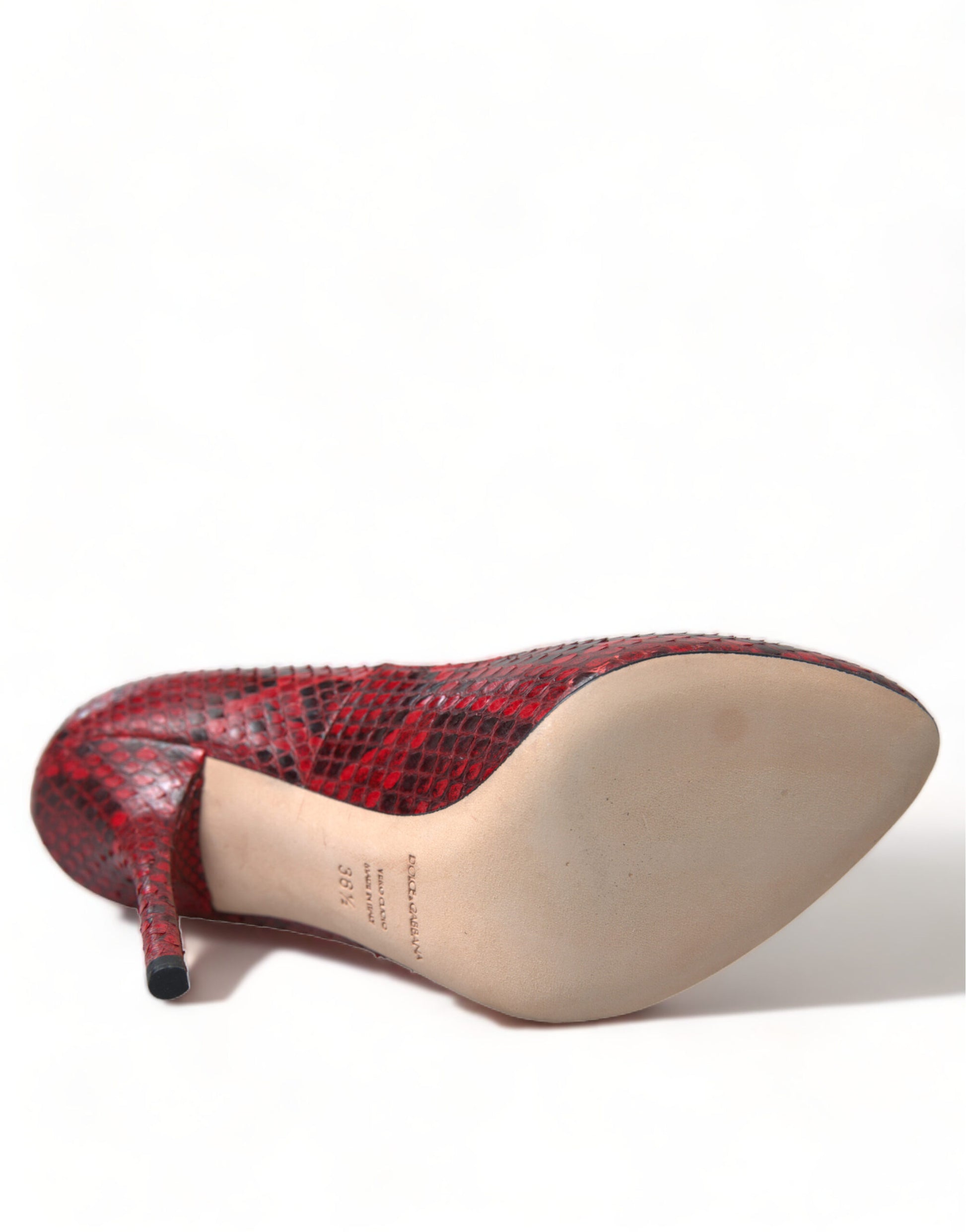 Red and black high heel shoe with a pointed toe