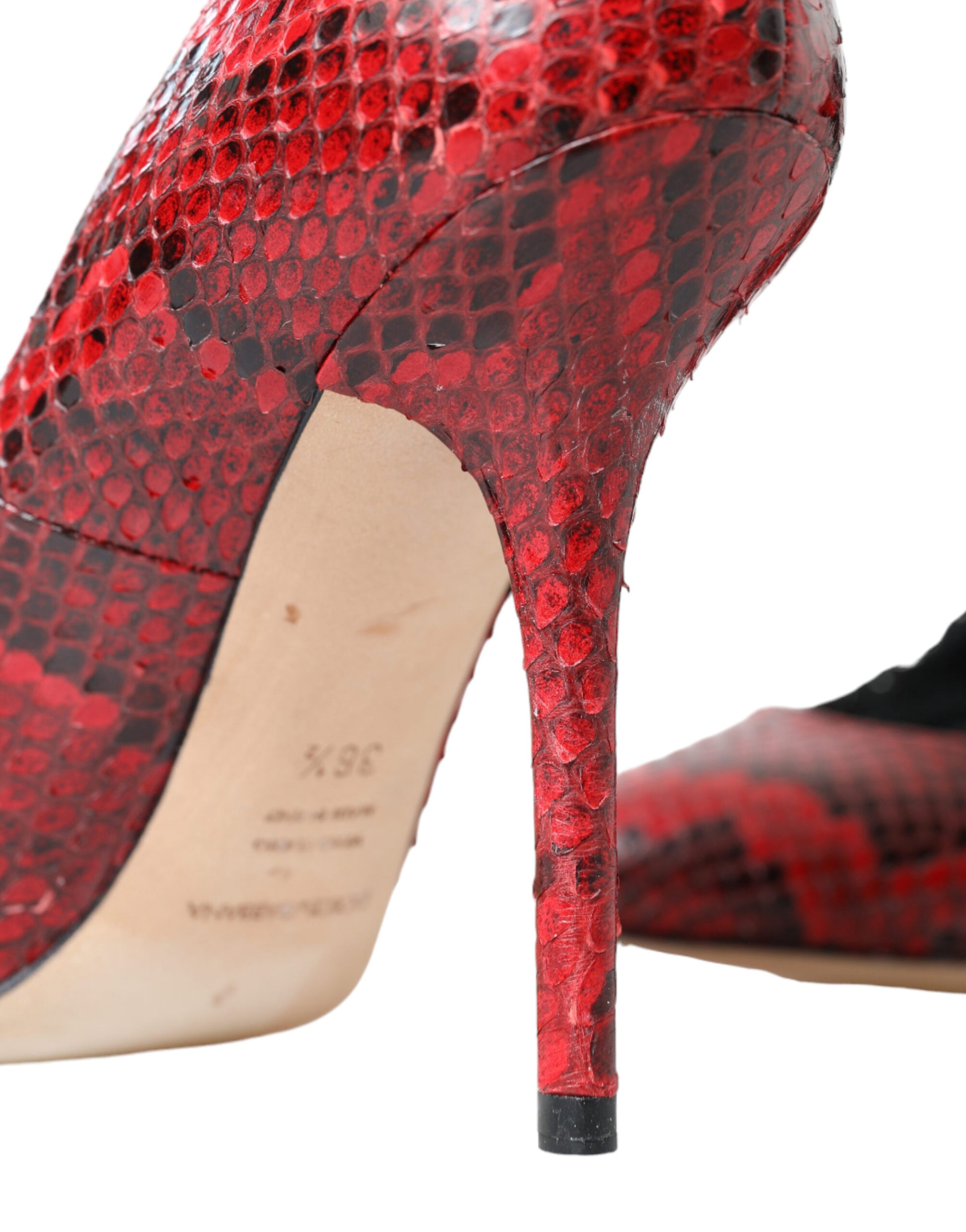 Red high heel shoe with snake skin texture and pointed toe