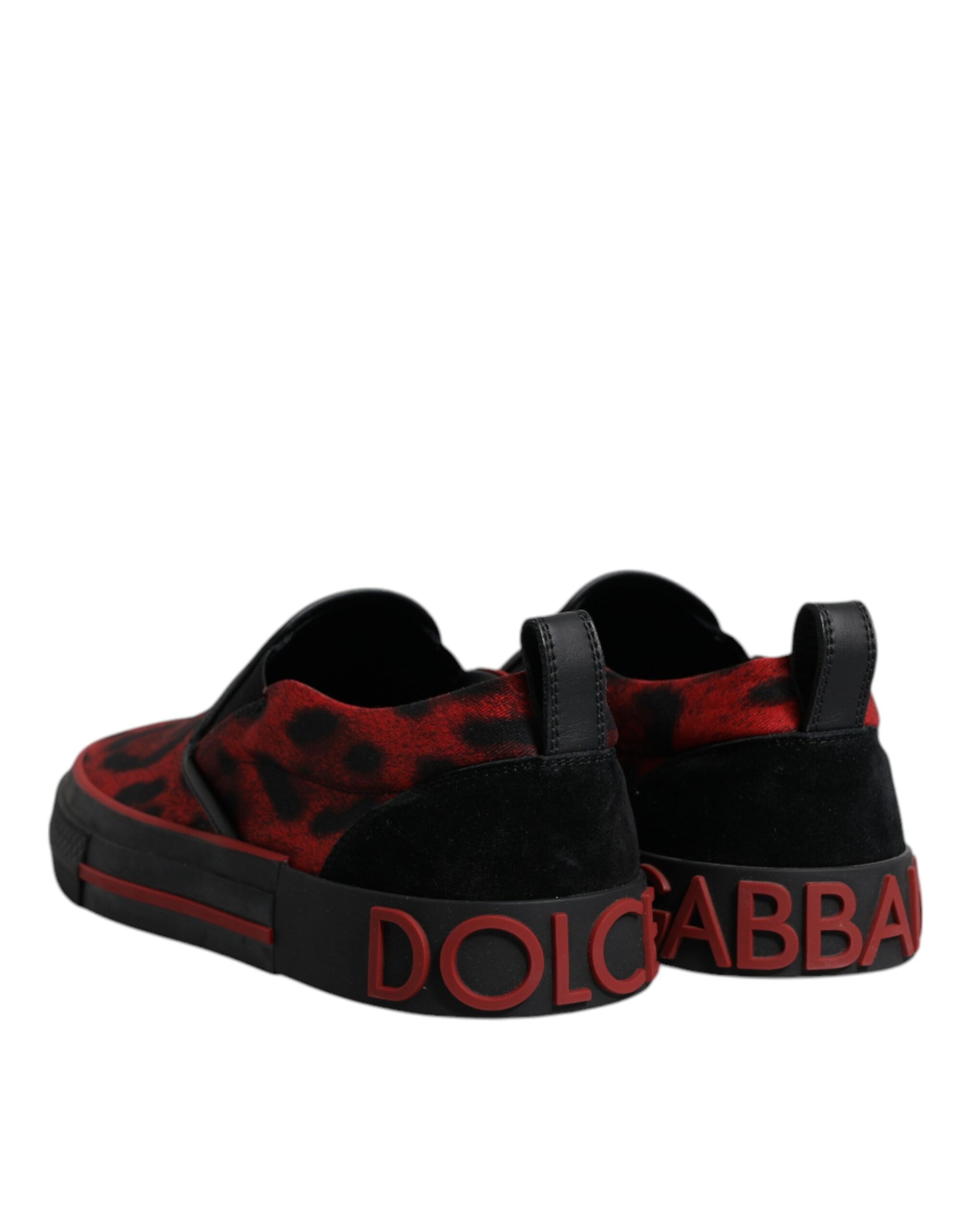 A pair of red black leopard print men's low top sneakers with the brand name "Dolce & Gabbana" on the side