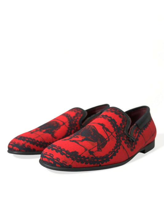Red patterned loafers with black soles and laces